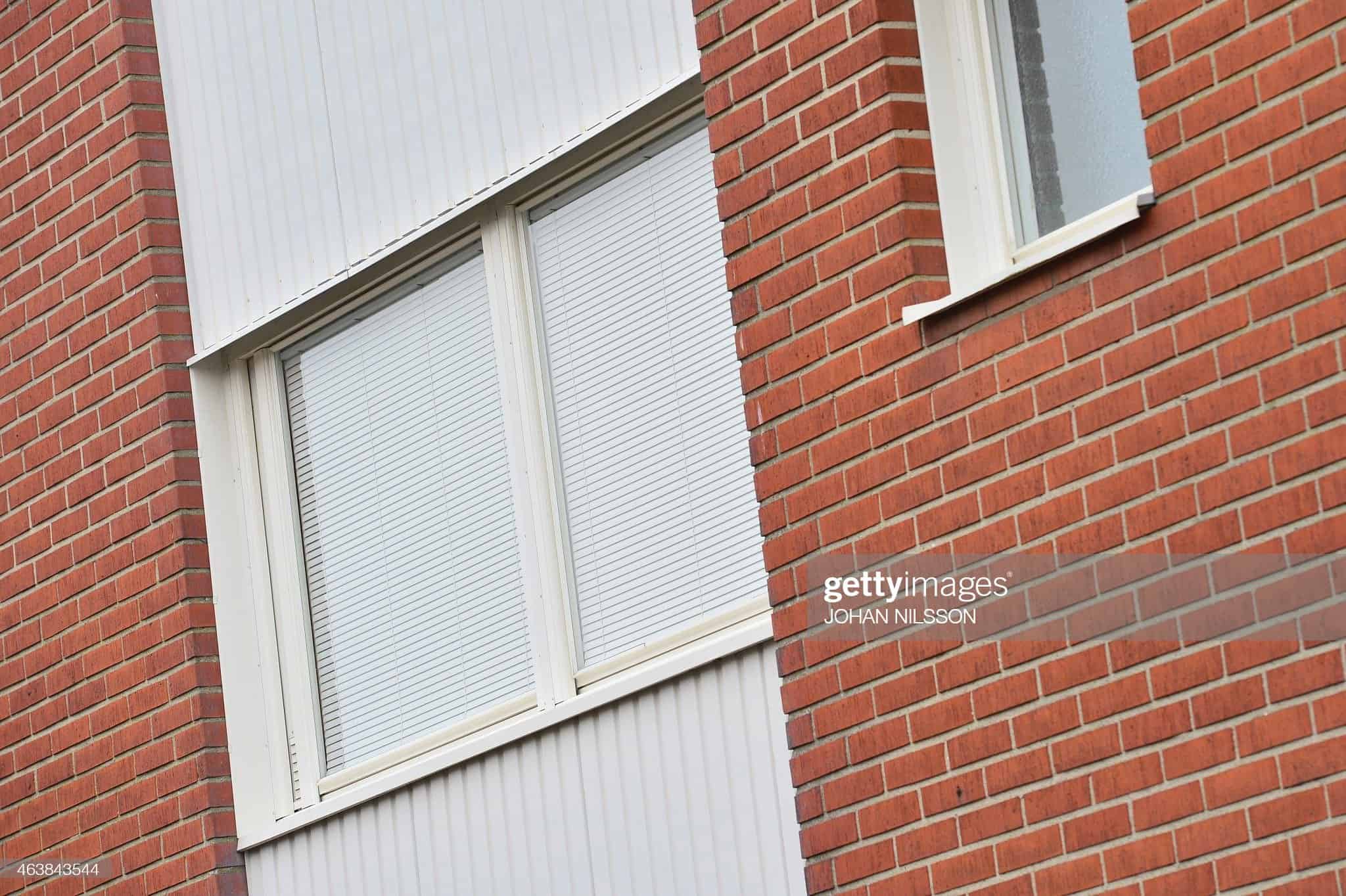 An exterior view of an apartment window of a house in Bromölla, southern Sweden, where used to live a woman on suspicion of locking her daughters away for a decade. Police suspected the 59-year-old woman had "restricted her children's freedom... for quite a few years," spokeswoman Ewa-Gun Westford told AFP.   AFP PHOTO / TT NEWS AGENCY / JOHAN NILSSON   *** SWEDEN OUT ***        (Photo credit should read JOHAN NILSSON/AFP via Getty Images)